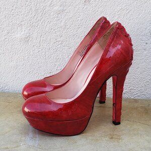 Betsy Johnson Dita patent leather platform pumps with lace up corset heel detail